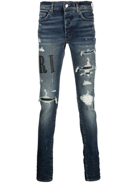 AMIRI distressed logo-print skinny jeans – TOPDROP-NEWYORK