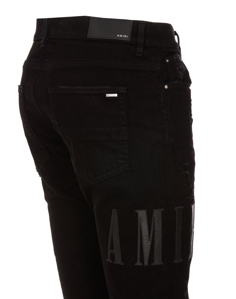 Amiri Amiri Mid-Rise Distressed Skinny Jeans